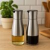 Stiklinis aliejaus buteliukas su dozatoriumi   – 2 vnt. po 320 ml
