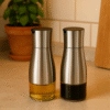 Stiklinis aliejaus buteliukas su dozatoriumi   – 2 vnt. po 320 ml